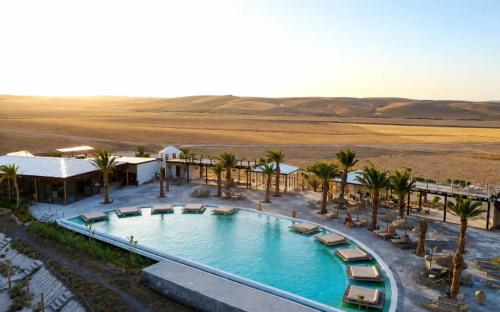 an overhead view of a swimming pool in the desert at Sunset Agafay Resort in El Karia