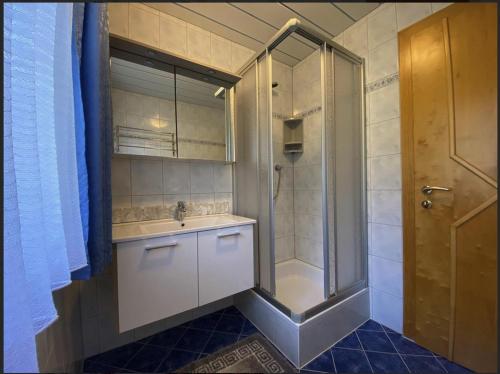 a bathroom with a shower and a sink at Haus Deutschmann in Wenns