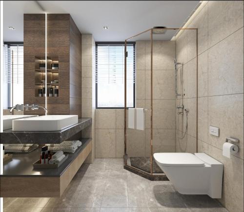 a bathroom with a sink and a toilet and a shower at The Roaring Pines in Dhikuli