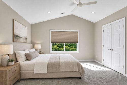 a bedroom with a bed and a window at PINE AND TIMBER GETAWAY in Jackson