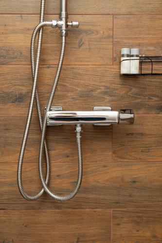 a hair dryer is hooked up to a wall at La casa de papel Apartment in Bjelovar