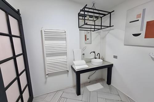 a bathroom with a black table and a sink at 6 Universal Access Comfort WiFi central heating in Coihaique