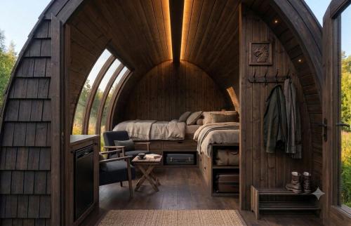 a bedroom in a hobbit house with a bed at The Perfect Stop - Viking Haven in Lødingen