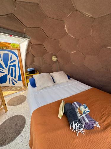 a bedroom with a bed in a tent at Dôme Nissaya in Nice