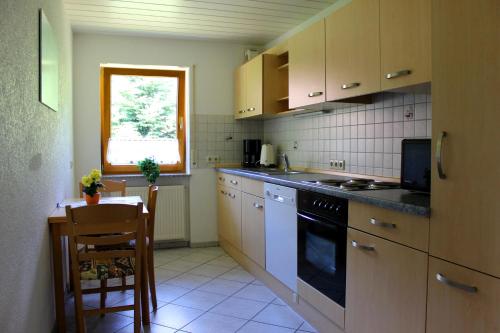 Kuchyň nebo kuchyňský kout v ubytování Ferienparadies Hugenhof