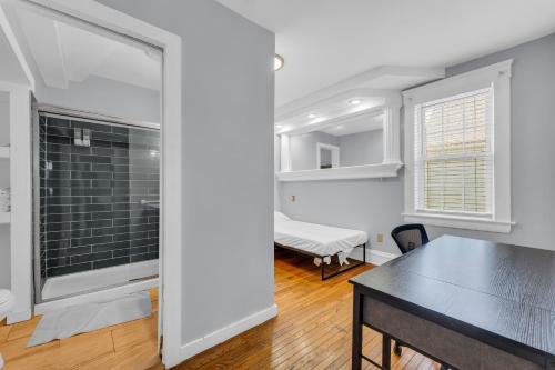 a kitchen and dining room with a table and a window at Stay with Jay - Quinta Suite in Cleveland