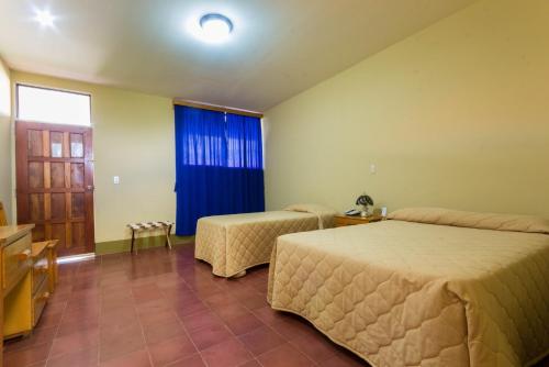 Katil atau katil-katil dalam bilik di Hotel Frontera