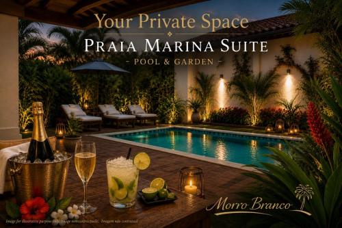 a table with wine glasses next to a swimming pool at Praia Marina Suite - Morro Branco in Beberibe