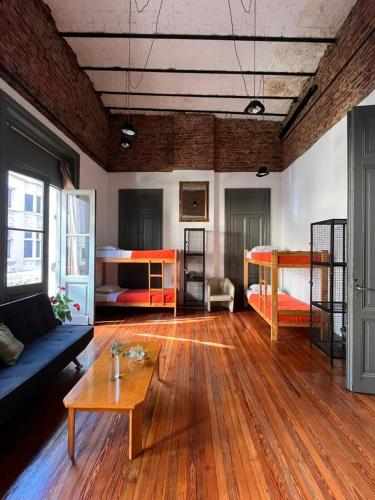 a living room with two bunk beds and a table at Malala in Buenos Aires