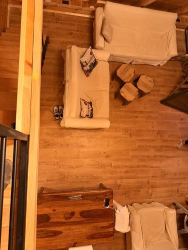 an overhead view of a room with chairs and wood floors at Max view Chalet Žabljak in Žabljak