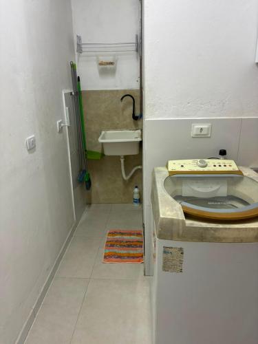 a small bathroom with a sink and a sink at Apartamento, 88 in Cabo de Santo Agostinho