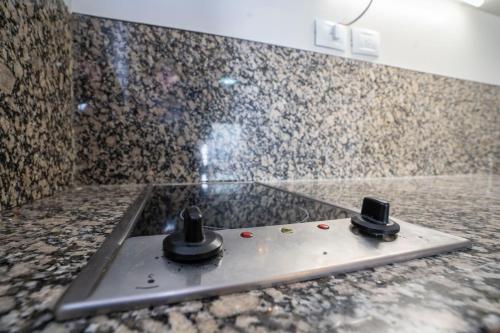 a bathroom with a shower with a counter top at San Telmo Spa in Buenos Aires