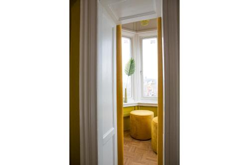a door leading into a room with a window at Little Duke Hotel in Den Bosch