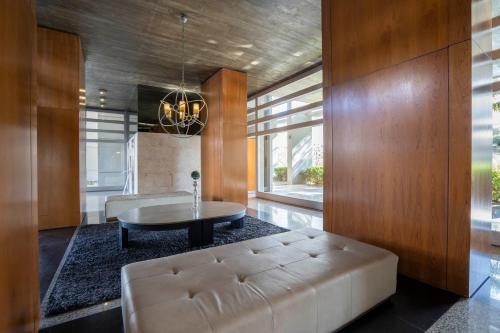 a living room with a white couch and a table at San Telmo Spa in Buenos Aires