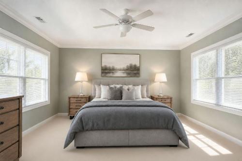 a bedroom with a bed and a ceiling fan at Jackson Pines Getaway in Jackson
