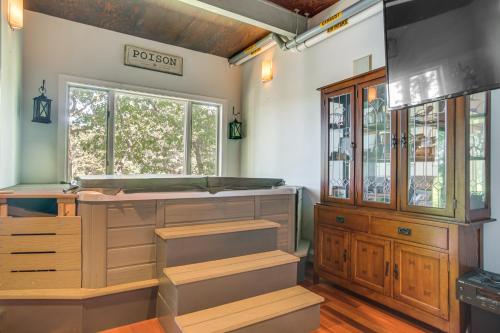 a kitchen with a wooden counter and a window at Riverside Extended Stay in Mashpee in Mashpee