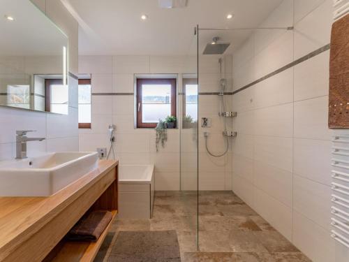 a bathroom with a sink and a shower at Tauernpanorama in Krimml