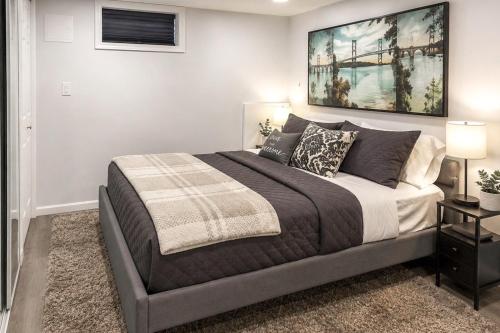 a bedroom with a bed and a painting on the wall at Saddle Brook Studio with Patio - Near NYC! in Saddle Brook
