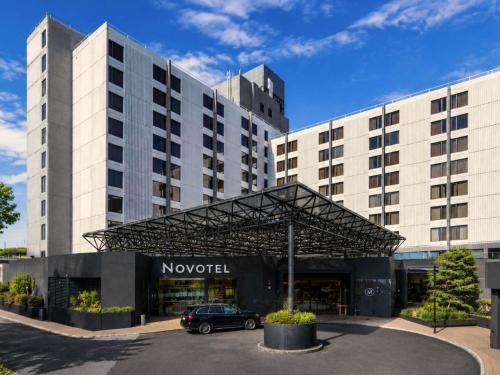 a car parked in front of a hotel at Novotel Sydney International Airport in Sydney