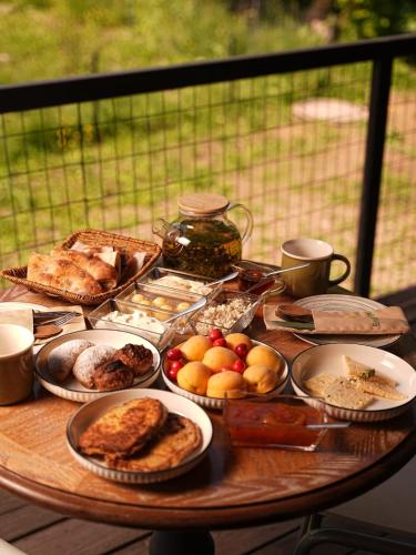 a table filled with different types of breakfast foods at Amaras Boutique Hotel Lori in Stepʼanavan