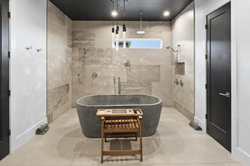 a bathroom with a large tub and a shower at Sunset Acres Ideal for all Occasions in Clermont