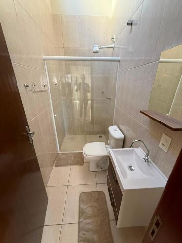 a bathroom with a shower and a toilet and a sink at Galante in Toledo
