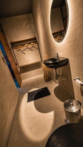 a bathroom with a sink and a mirror at Hotel Boutique Urban in San Gil