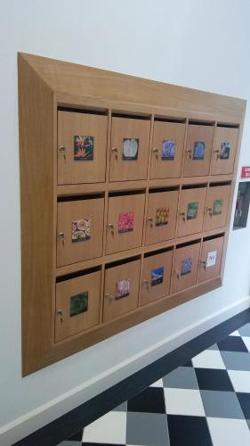 a display of lockers in a room at The Marketplace by Storytellers in Funchal