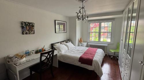 a bedroom with a desk and a bed and a desk and a chair at Cozy room with private bathroom near subway in Toronto