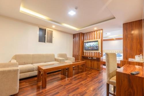 a living room with a couch and a table at Hotel Dreams Connect GRB 2 in Kathmandu