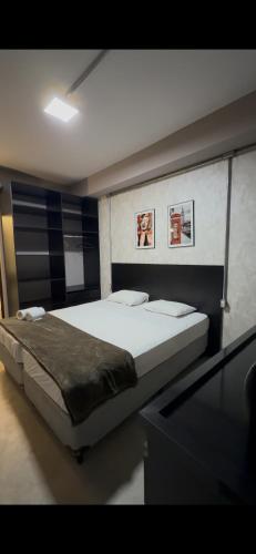 a bedroom with a large bed in a room at Add Hotéis Mascote in São Paulo
