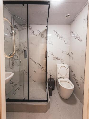 a bathroom with a shower and a toilet at As-Mira Hotel in Samarkand