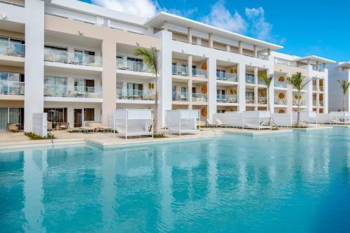 an exterior view of a resort with a swimming pool at Paradisus by Meliá Grand Cana - All Suites - All Inclusive in Punta Cana