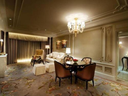 a living room with a couch and a table at L'Arc Hotel Macau in Macau