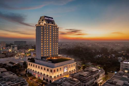 a tall building with a sign on top of it at Meliá Vinpearl Tay Ninh in Tây Ninh