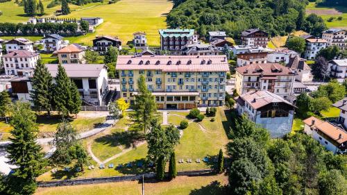 an aerial view of a large building in a town at Hotel Auronzo Dolomites, Affiliated by Melia in Auronzo di Cadore