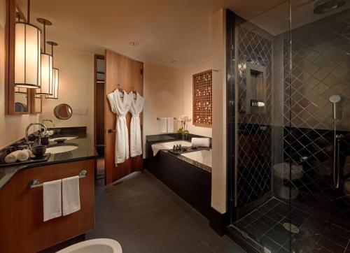 a bathroom with a sink and a shower and a toilet at The Setai, Miami Beach in Miami Beach