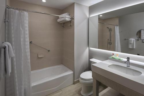 a bathroom with a sink and a toilet and a shower at Hyatt Place San Pedro in San Pedro Sula