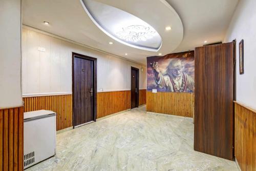 a large room with a painting on the wall at Hotel Sai Deluxe in New Delhi