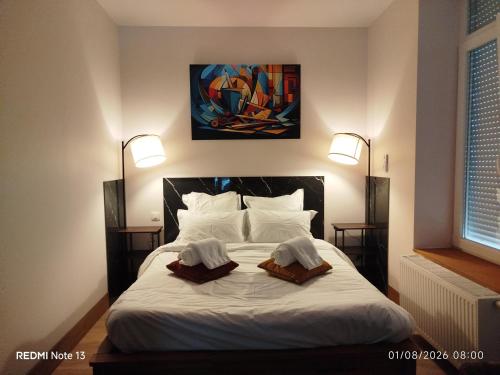 a bedroom with a bed with two towels on it at Gîte "fils de laine" Piscine chauffée interieure et Sauna ouverts toute l'année in Celles-sur-Plaine