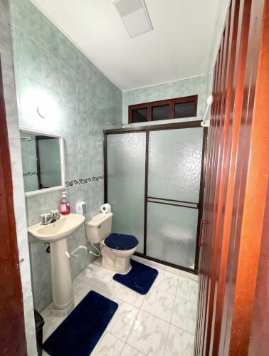 a bathroom with a toilet and a sink and a shower at Hotel Montserrat Luxury in Valledupar