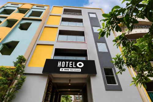 a hotel sign on the front of a building at Hotel O Visakhapatnam Railway Junction Formerly Kesava Residency in Visakhapatnam