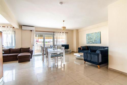 a living room with a couch and a table at 3 Bedroom Apartment, Easy Parking in Alexandroupoli