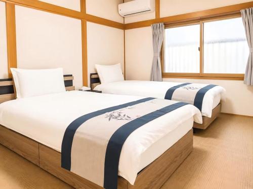 Yuraku USJ 5 minutes Nishikujo Station 5 minutes on foot Entire house for exclusive use Two toilets Maximum 7 people Direct access to Umeda, Osaka in 4 minutes Direct access to Kansai Airport