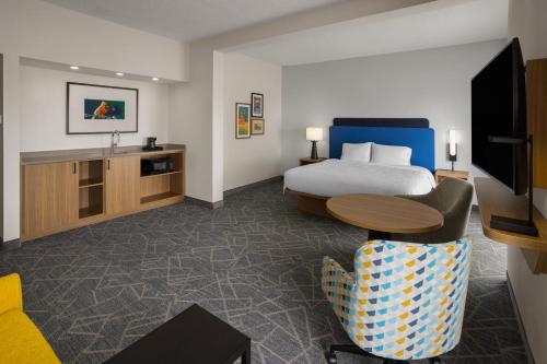 a hotel room with a bed and a table at Hampton Inn Staunton in Staunton