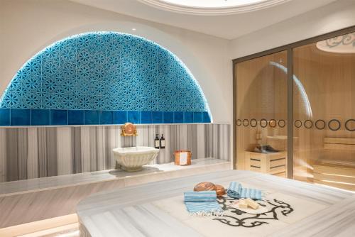 a bathroom with a tub and a sink at DoubleTree By Hilton Istanbul - Moda in Istanbul