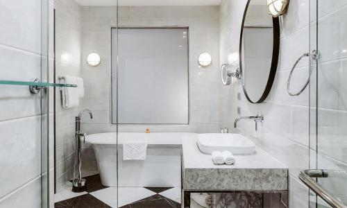 a white bathroom with a sink and a mirror at Doubletree By Hilton Wellington in Wellington