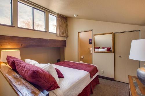 a bedroom with a large bed and a window at Wapato Point Resort in Manson