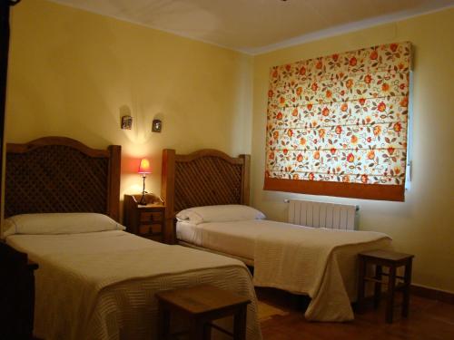 Кровать или кровати в номере Finca Dehesa Tres Riveros
