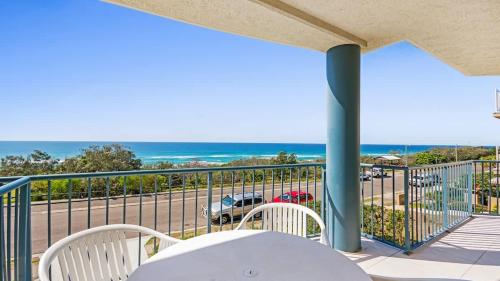 a balcony with a view of the ocean at Pacific Waves Apartments in Noosa Heads